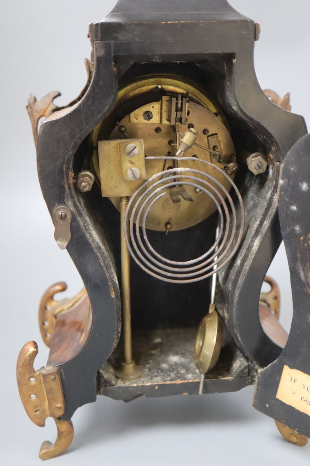 A late 19th century French tortoiseshell and ormolu mantel clock, with enamelled dial, height 38cm